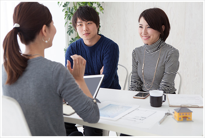 A young couple with a female mortgage broker