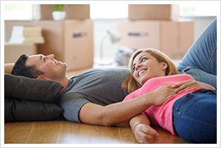 Young couple resting from moving into a new home